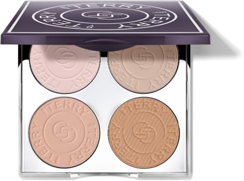 Four pressed powders in a compact, with pink, beige, peach, and bronzed shades, labeled 'Terry'.