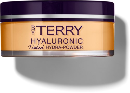 En burk med tinted Hydra-Puder av Terry Hyaluronic i lila och beige färger.