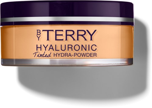 A round container with purple lid and peach-colored body, labeled "BY TERRY HYALURONIC Tinted Hydra-Powder."
