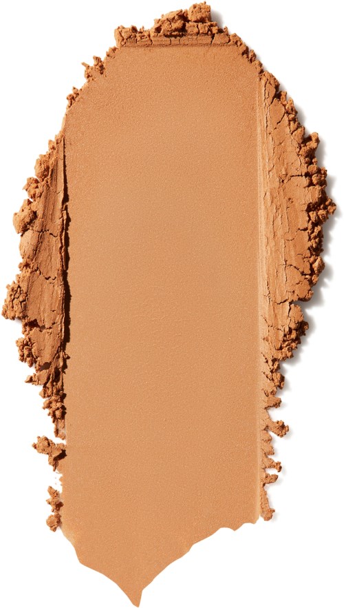 En beige, krossad pulver eller makeup med ruffiga kanter och en rektangulär form.