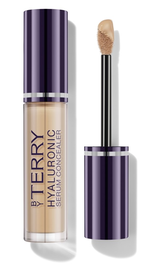 A beige liquid concealer with purple packaging and a wand applicator.