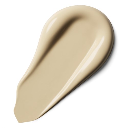 A beige, elongated, curved object with a smooth surface, resembling a dollop of cream or gel.