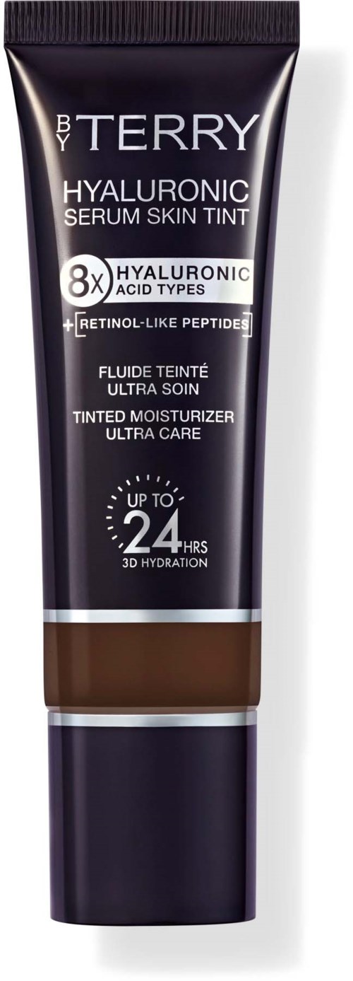 A black tube of B By Terry Hyaluronic Serum Skin Tint with white text and a brown color at the bottom.