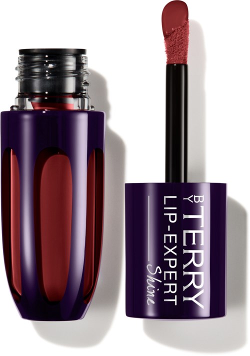 En lilla leppestiftbeholder med åpnet lokk, viser rosa leppestift inni, merket "BERRY LIP-EXPERT".