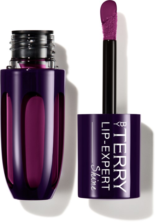 En lilla leppeglobottle med påføringspinn, merket 'BERRY LIP-EXPERT Shine'.