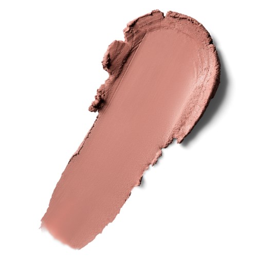 A smear of brownish-beige makeup or face powder on a white surface.
