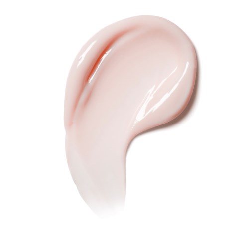 En myk rosaaktig krem eller lotion er spredd på en hvit bakgrunn, med en jevn, skinnende tekstur.
