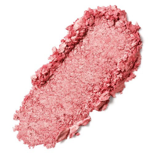 Et rosa, knust pulver med ujævne kanter. Ser blødt og tekstureret ud, sandsynligvis makeup eller kosmetikprodukt.