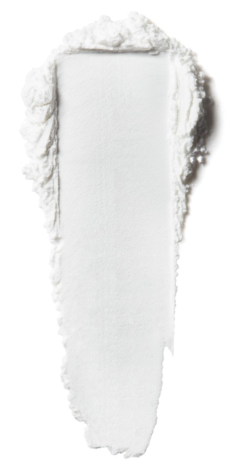 A long, rectangular strip of white powder, surrounded by a rough, uneven outline of the same material.