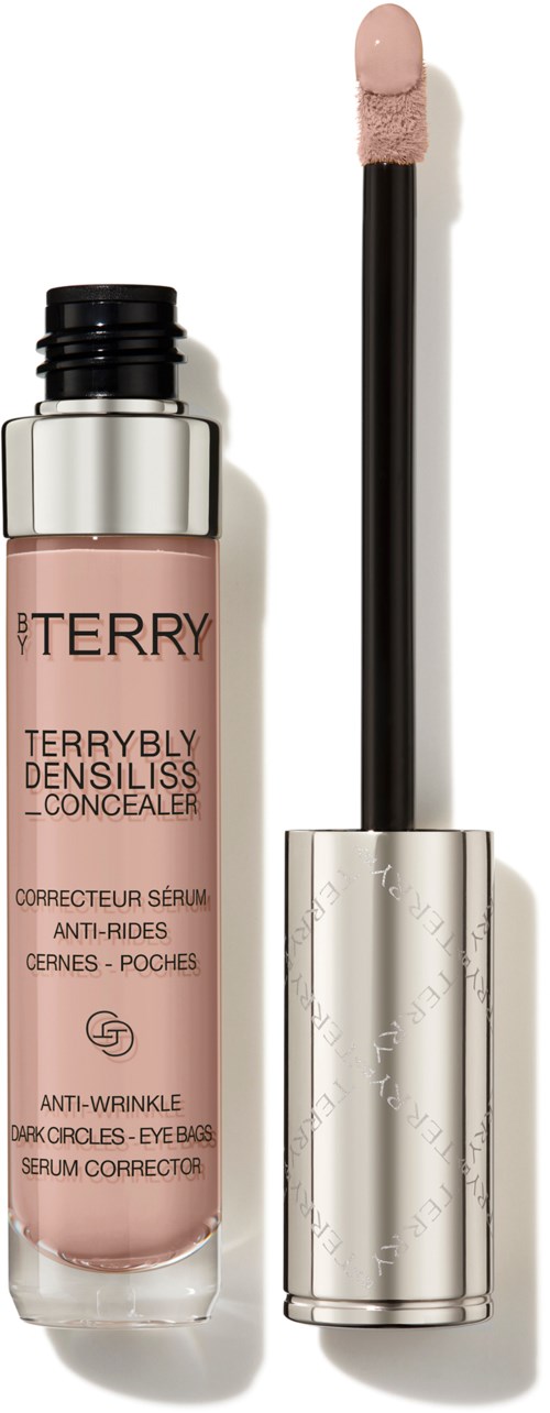 En foundation/concealer-flaska med en applikatorstång bredvid, märkt 'Terrybly Densiliss' av ett skönhetsmärke.