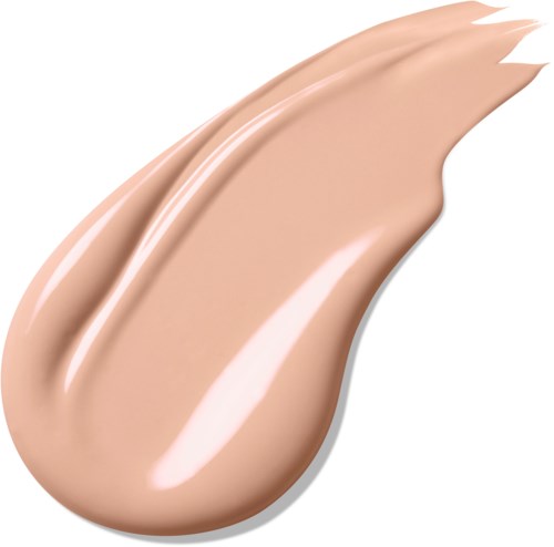 Ett beige flytande kosmetikstänk formad som en penseldrag, slät och krämig.