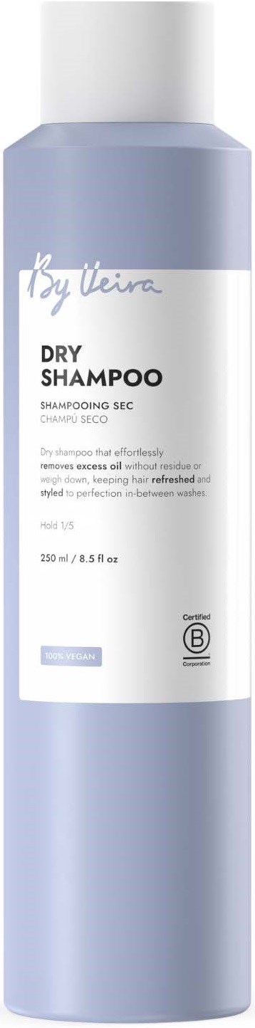 A tall, light purple bottle of dry shampoo with a white label and cap.