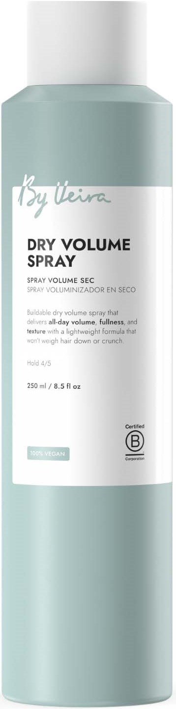 A light blue cylindrical bottle of dry volume spray with white cap and label showing product name and details.