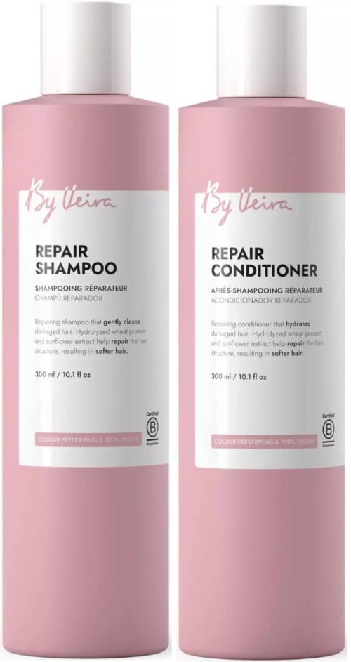 Two pink bottles of hair care products, one for repair shampoo and the other for repair conditioner, from By Wishtrend.