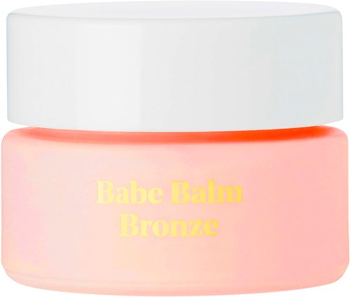 A small round container with a white lid, peach-colored body, and yellow text saying 'Babe Balm Bronze' inside.