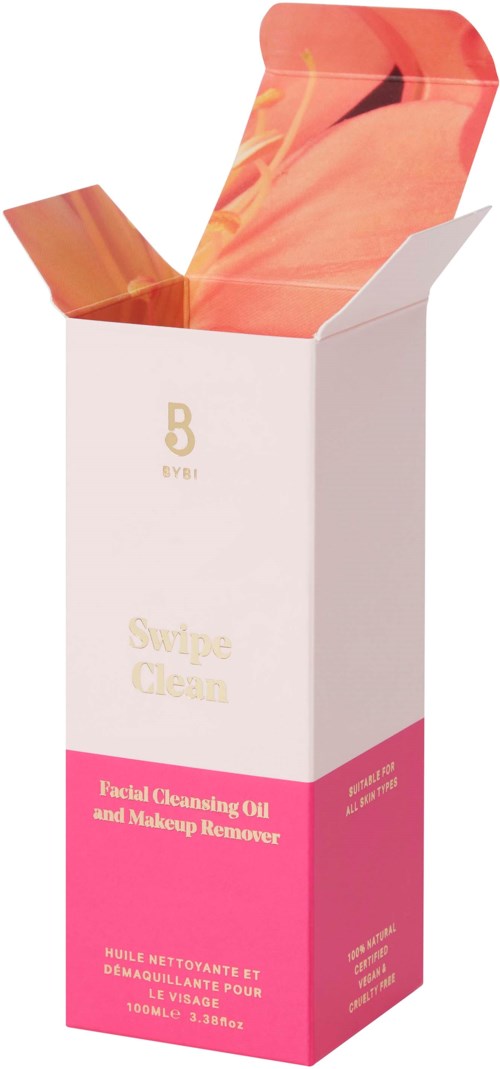 En hvid boks med pink label, åbnet for at vise orange og pink makeup-korsedrysler.
