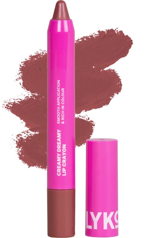 Różowy konturówka do ust z brązowym końcówką, oznaczona jako creamy dreamy lip crayon, z brązową plamą tła.