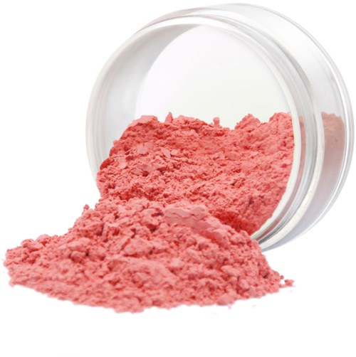 Ljust rosa pulver som spillts från en genomskinlig behållare, troligtvis för kosmetika eller målning.