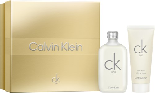 Calvin Klein-Logo, goldene Box, Parfümflasche und Körpersahne Tube.