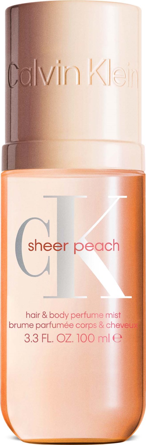 Calvin Klein sheer peach hår- och kroppsspray i en rosa sprayflaska.