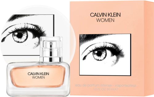 A Calvin Klein Women perfume box features a black-and-white eye illustration and a transparent bottle with peach-colored scent.