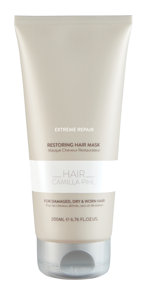 En hvit tube med hårmaske merket 'Extreme Repair' for skadet, tørt og slitt hår, med tekst som viser at den er 200 ml.