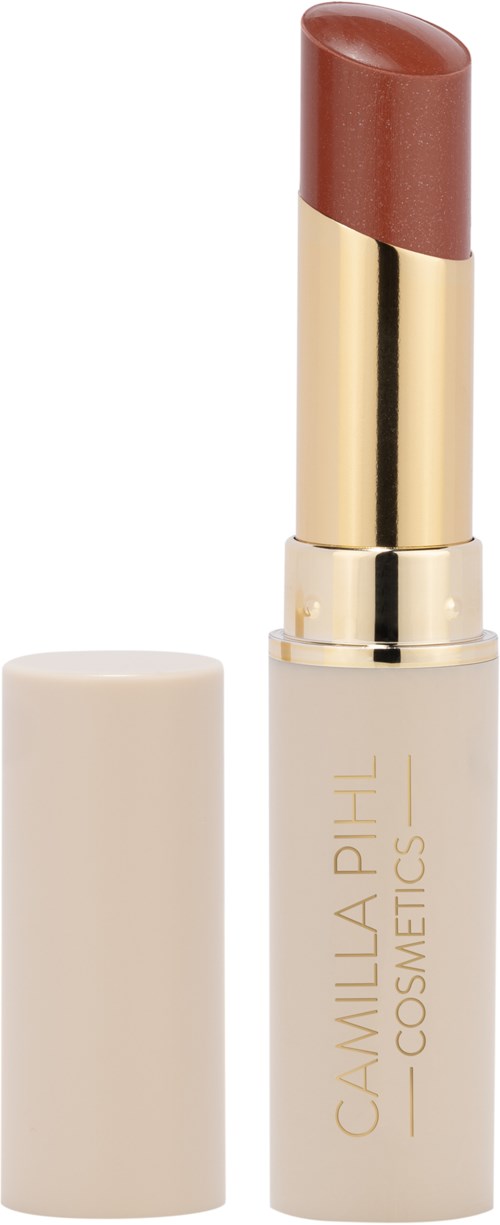 En läppstift med guld- och vit förpackning, visar en brun nyans. Locken är av, och läppstiftet syns.