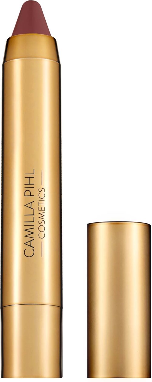Ett guldigt läppstift med märkningen Camilla Pihl Cosmetics och en avtagbar plugg.