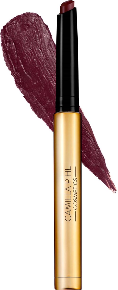 Lipstick with a dark red shade and gold and black packaging, with a swatch of the lipstick color behind.