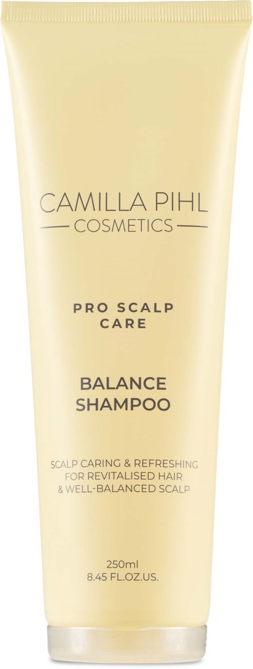 Vaaleankeltainen tuubi Camilla Pihl Cosmetics Balance Shampoo, musta teksti, 250 ml.