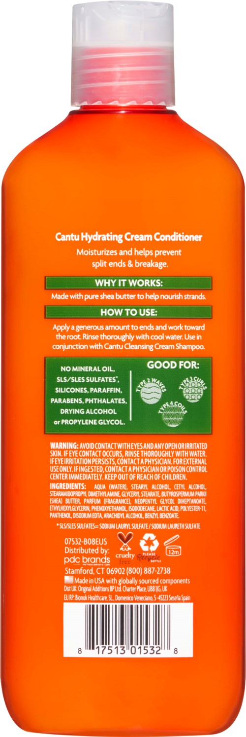 En orange flaska med vit lock, etiketten har instruktioner och ingredienser i vitt och grönt.