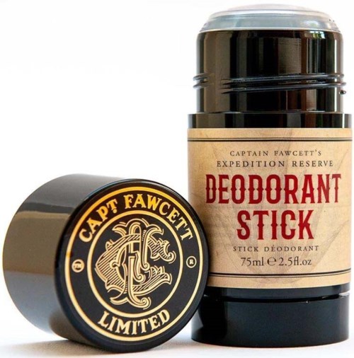Ett deodorantstiftetui med beige etikett och röd text, bredvid ett runt lock med en svart och gul logo.