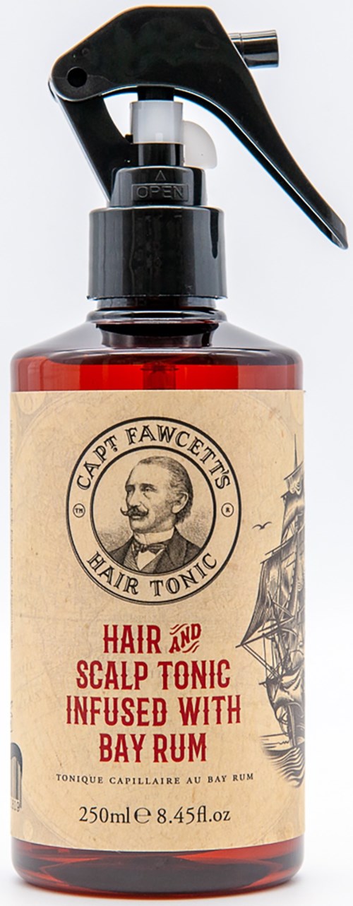 En flaske merket 'Hair and Scalp Tonic' med spraymunnstykke og en vintage-lignende etikett med et manns ansikt.