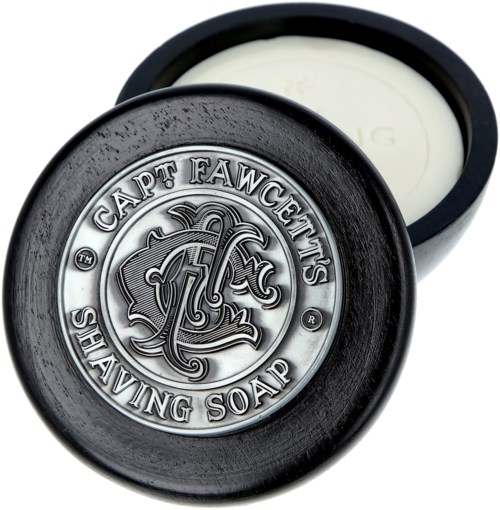 En rund behållare med lock som visar en logo med ett lejon och text för "Cat Fawcett's Shaving Soap".