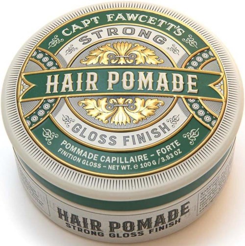 En rund metallburk märkt "Hair Pomade" med dekorativt guld- och grönt design, visar att det ger en stark glans finish.