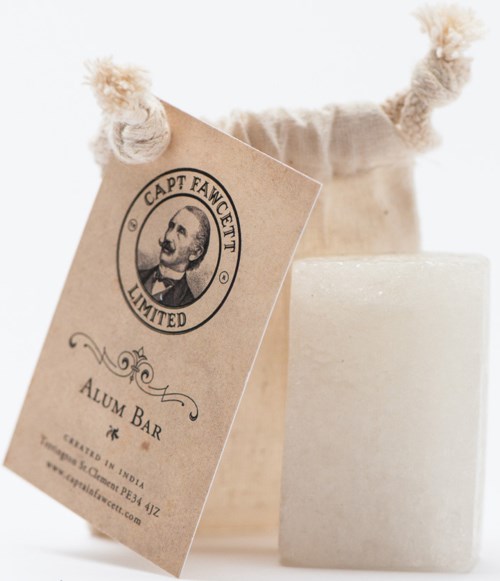 A soap bar with a tag that has a vintage man’s face and text "CAPT FANCETTI LIMITED" on it.