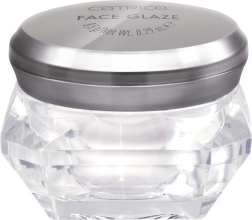 A small, round jar with a clear, faceted body and a silver lid designed for face cream.