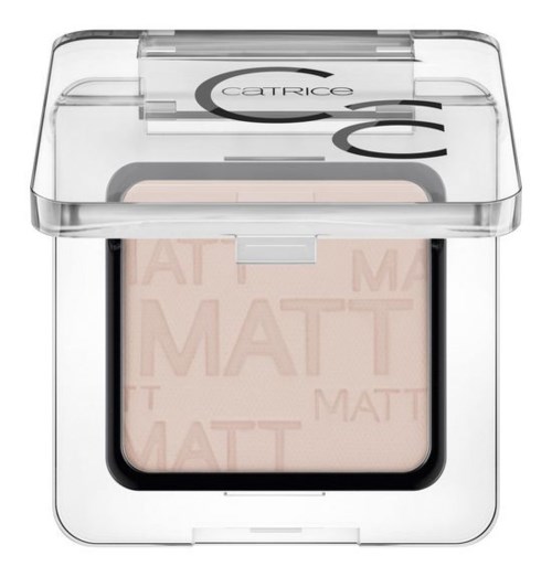 En kompakt makeupprodukt med genomskinligt lock, visar ett beige matt puder inuti, märkt med varumärket 'Catrice.'