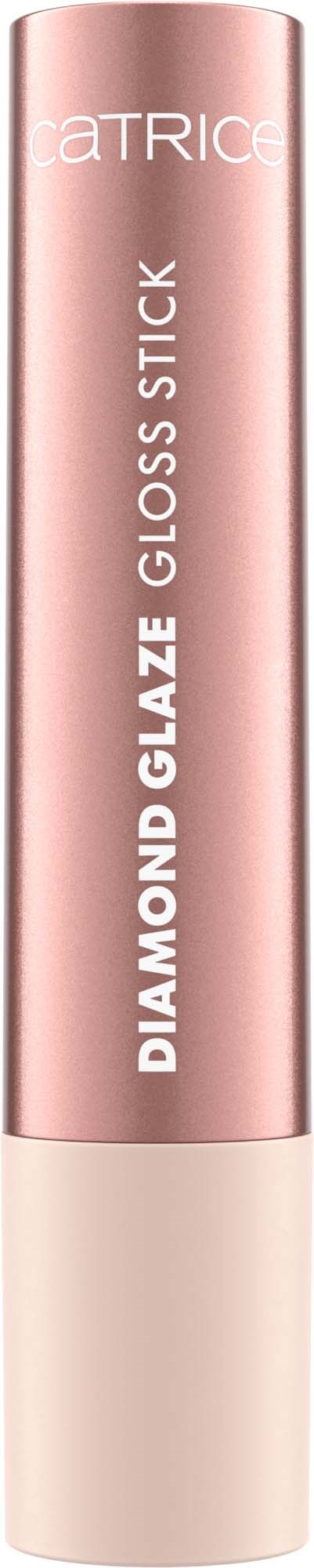 Vaaleanpunainen putki, jossa lukee 'Catrice Diamond Glaze Gloss Stick', seisoo pystyasennossa mustan taustan edessä.