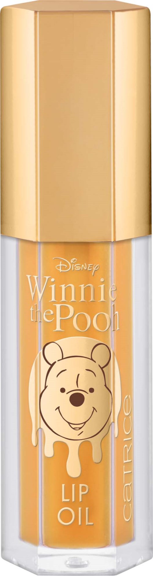 Huulilakka, jossa Winnie the Pooh, kultainen korkki ja oranssi tarra näyttävät Poohin kasvon ja nimen.