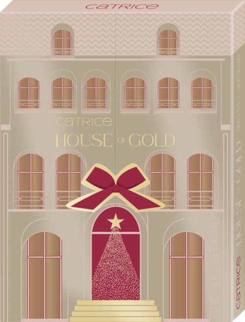 Förpackningsask med rosa band och en stjärna, liknande en present eller parfymask from Catrice House of Gold.