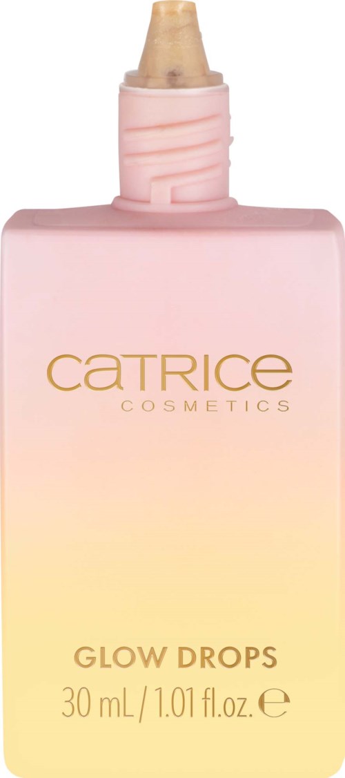 En rosa og gul flaske med lokk og dråper for kosmetikk, merket "Catrice Glow Drops," 30 mL.