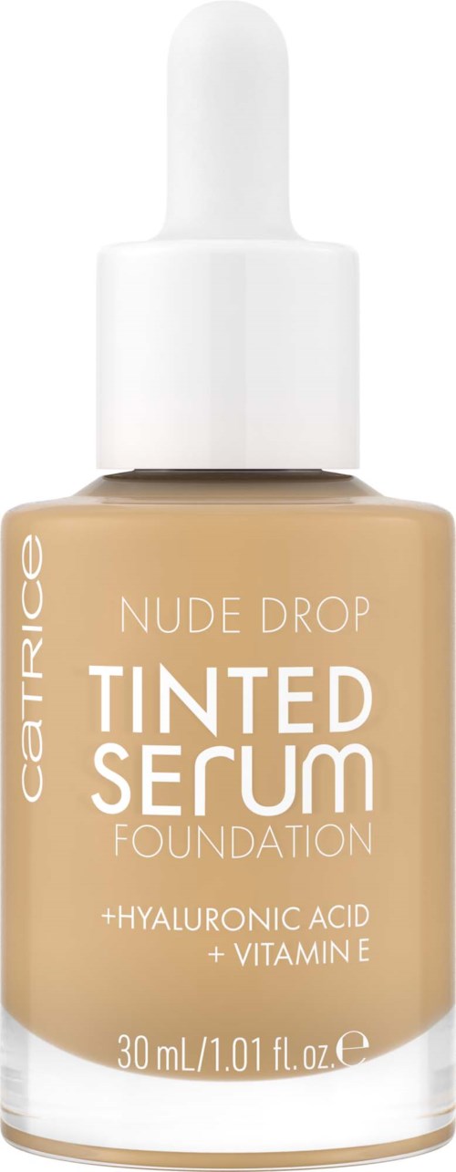 A bottle of beige foundation with a white dropper cap, labeled 'Catrice Nude Drop Tinted Serum' with ingredients listed.