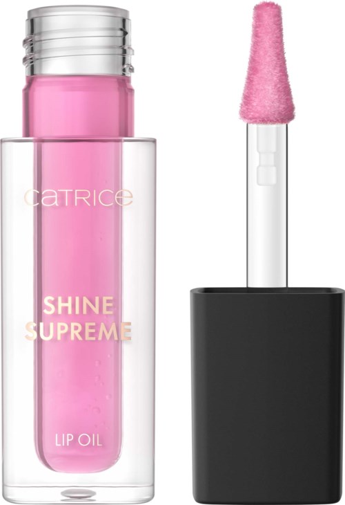 Różowa butelka olejku do ust z pędzelkiem, etykieta mówi Shine Supreme Lip Oil marki Catrice.