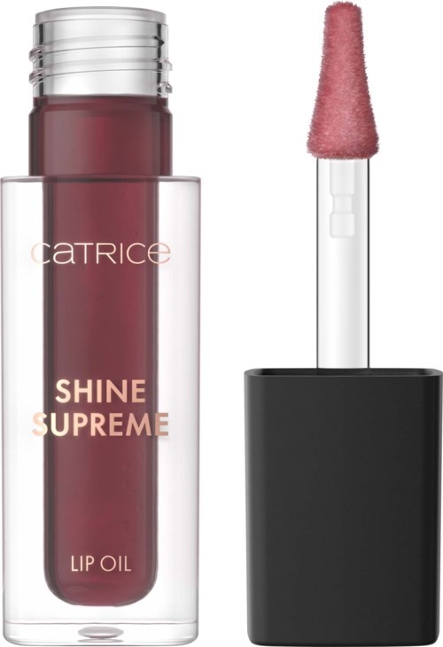 Tuba olejku do ust z gąbkowym aplikatorem i czarnym pokrywką. Etykieta czyta Shine Supreme Lip Oil.