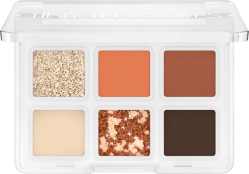Six makeup shades in a clear case: glittery, peach, brown, cream, mixed glitter, dark brown.