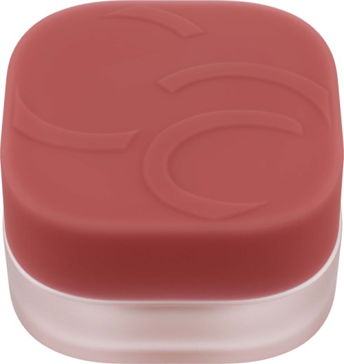 A square pink soap with a faint design on top and a white base.