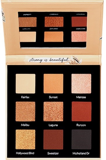 En sminkpalett med ni øyenskygger i beige-, oransje- og bruntoner. Den har et speil og en positiv melding.