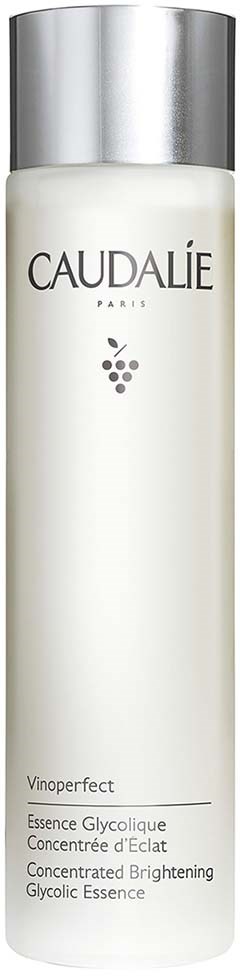 Pitkä valkoinen pullo hopeaisella kannella, merkiltä Caudalie Vinoperfect Glycolic Essence kasvojen kirkastamiseen.