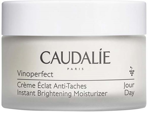 A white jar of Caudalie Vinoperfect Brightening Moisturizer for day use.